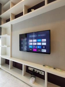 a flat screen tv on a wall in a living room at The Platinum KLCC in Kuala Lumpur