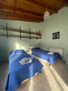 Postel nebo postele na pokoji v ubytování Alojamiento Chacabuco