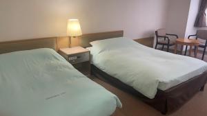 Postel nebo postele na pokoji v ubytování Olympic Inn Kanda + 4 fotografie