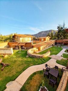 an aerial view of a yard with a table and chairs at Yuyay Wasi Bungalows in Urubamba