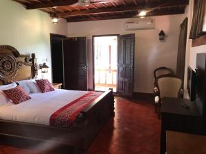 Postel nebo postele na pokoji v ubytování Heaven Inn Munnar