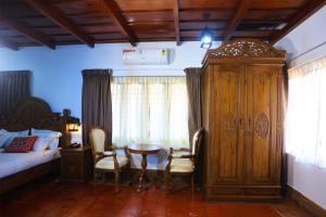 Postel nebo postele na pokoji v ubytování Heaven Inn Munnar