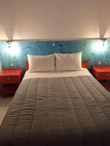 Voodi või voodid majutusasutuse Hotel Theoxenia toas