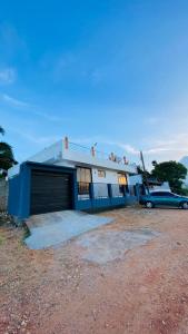 a blue car parked in front of a building at KPN Trinco Holiday Resort in Trincomalee
