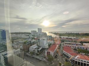 a view of a city with a river and buildings at Imperial Suites by Evernent in Miri
