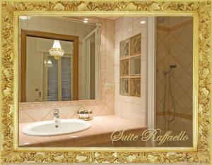 a bathroom with a sink and a mirror at B&B Babri Simim Taj in Rome