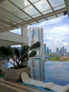 a view of a city skyline from a building at TWIN GALAXY JB Homestay by SUMMER in Johor Bahru