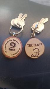 two key chains with the hairs and the flats on them at The Flats in Ávila