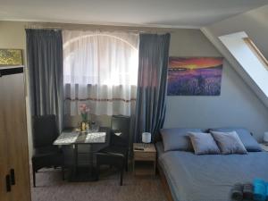 A bed or beds in a room at APARTMÁNY PIETRO