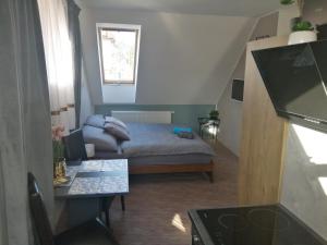 A bed or beds in a room at APARTMÁNY PIETRO