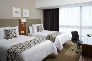 Postel nebo postele na pokoji v ubytování Casa Inn Premium Hotel Queretaro