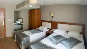A bed or beds in a room at Reikartz 2017