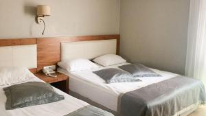 A bed or beds in a room at Reikartz 2017
