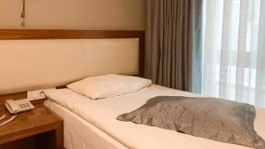 A bed or beds in a room at Reikartz 2017