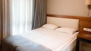 A bed or beds in a room at Reikartz 2017