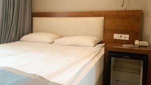 A bed or beds in a room at Reikartz 2017
