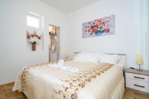 Postel nebo postele na pokoji v ubytování Apartment Debos + 20 fotografií