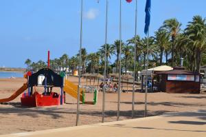 a playground on a beach with palm trees at Arona 2 - 5208 in Mar de Cristal