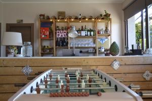 a bar with a pool table in front of it at Good Morning Etna in Bronte