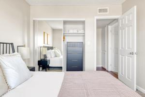 a bedroom with a bed with a blue door at Woodland Hills 2BR w Pool Gym nr Warner Center LAX-699 in Los Angeles +25 photos