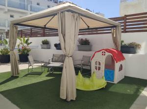 a tent with a play house and a dog house at Napa City Apartments in Ayia Napa