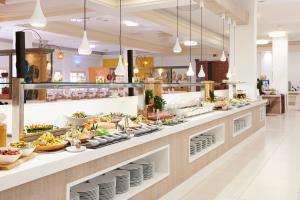 a buffet line with food on display at Iberostar Club Palmeraie Marrakech All Inclusive in Marrakesh