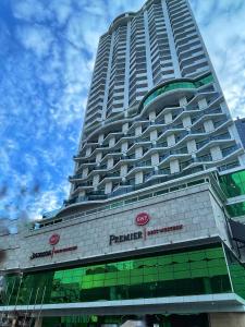 un gran edificio con un cartel en el costado en Best Western Premier Batumi en Batumi