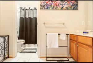 a bathroom with a sink and a toilet and a shower at Van Gogh Guest Rm #3 • Van Gogh 3-Comfy Private Rm in single family home in Rosedale