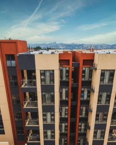 an aerial view of a tall apartment building at Rose Garden Private Apartment By LINK in Kigali