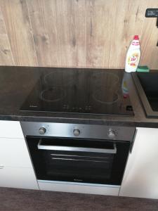 A kitchen or kitchenette at APARTMÁNY PIETRO