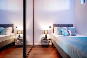 Łóżko lub łóżka w pokoju w obiekcie Ottimo Apartamenty Jagiellońska