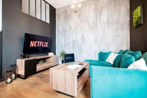 Telewizja i/lub zestaw kina domowego w obiekcie Ottimo Apartamenty Jagiellońska