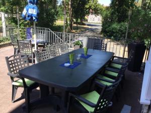 a black table and chairs with drinks on it at Adam`s Schützenhof in Hornburg