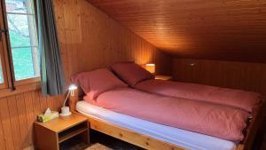 Postel nebo postele na pokoji v ubytování Chalet ALPEN LOTUS