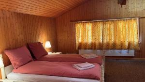 Postel nebo postele na pokoji v ubytování Chalet ALPEN LOTUS