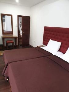 Postel nebo postele na pokoji v ubytování Nive Inn + 12 fotografií