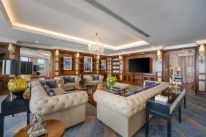 a living room with couches and a tv at Minh Toan Galaxy Hotel in Danang