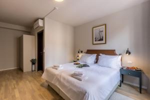 Postel nebo postele na pokoji v ubytování Leonis Restaurant & Rooms