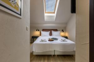 Postel nebo postele na pokoji v ubytování Leonis Restaurant & Rooms