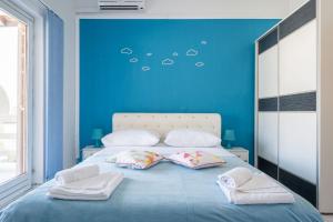 Postel nebo postele na pokoji v ubytování LaidBack Apartments