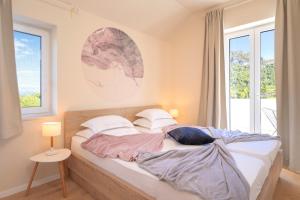 Postel nebo postele na pokoji v ubytování Villa Anouk