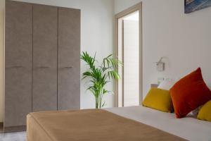 Postel nebo postele na pokoji v ubytování Nido Suite & Apartments