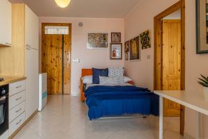 A kitchen or kitchenette at Lido degli Estensi Terrace Apartment