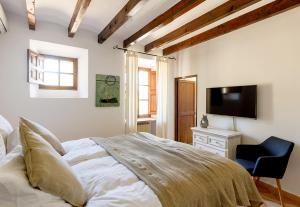 Posteľ alebo postele v izbe v ubytovaní Finca Can Coll Boutique Country House - Adults Only
