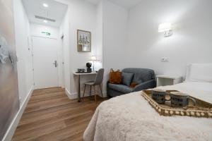 Center Suite Acebedos客房内的一张或多张床位