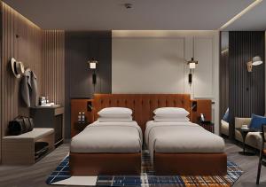 Ramada Encore by Wyndham Indore Nipania客房内的一张或多张床位