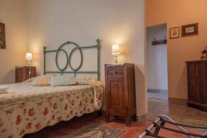 Postel nebo postele na pokoji v ubytování Agriturismo La Ripolina
