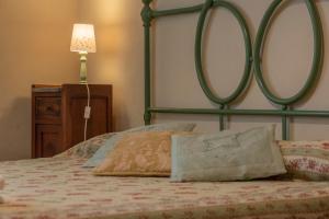 Postel nebo postele na pokoji v ubytování Agriturismo La Ripolina