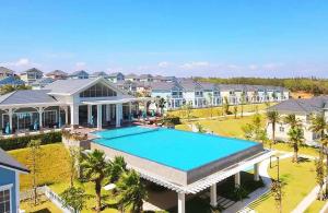 an aerial view of a house with a swimming pool at Novaworld Villas in Phan Thiet
