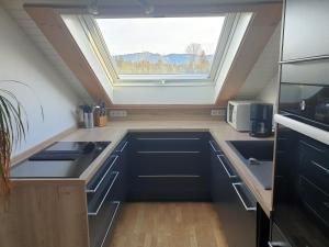 a kitchen with a sink and a window at Ferienwohnung Flösserstube in Bichel